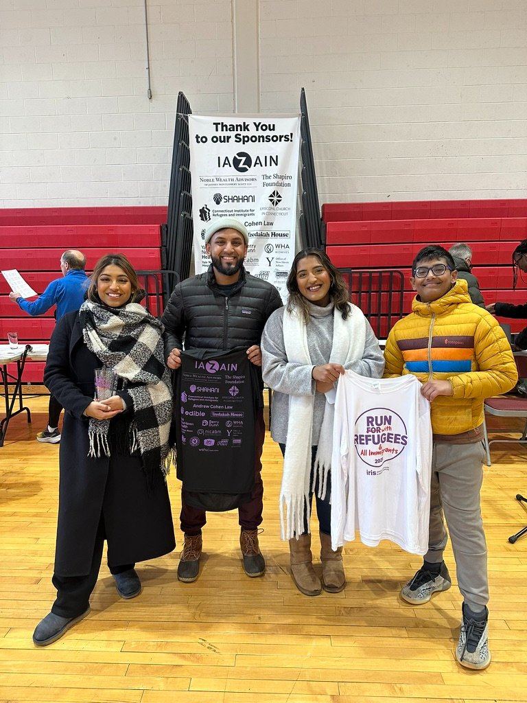 Volunteers at the IRIS Run for Refugees sponsor night