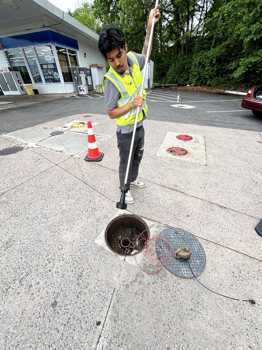 Shahani technician checking a tank fill